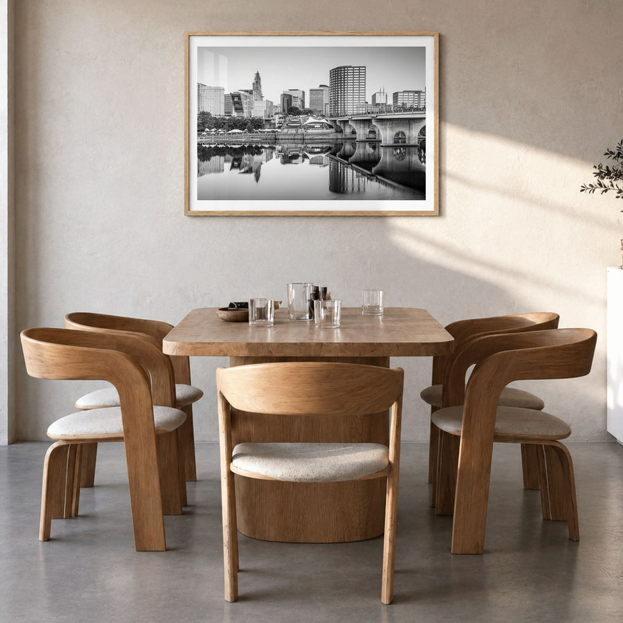 Connecticut Photo Poster in a natural wood frame, hanging in a dining room, white border