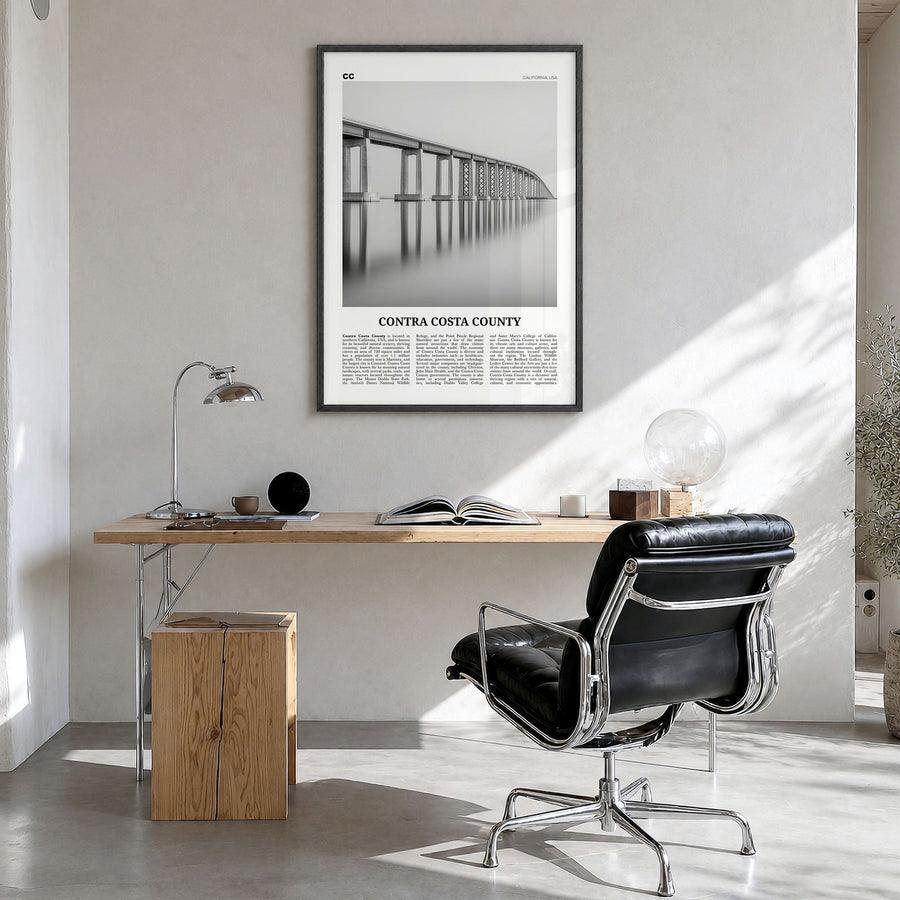 Contra Costa County Newspaper Poster in a black wood frame, hanging in a bright home office