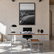 Coogee Beach black & white photo poster of Sydney, New South Wales – vertical wall art in black wood frame, hanging on wall