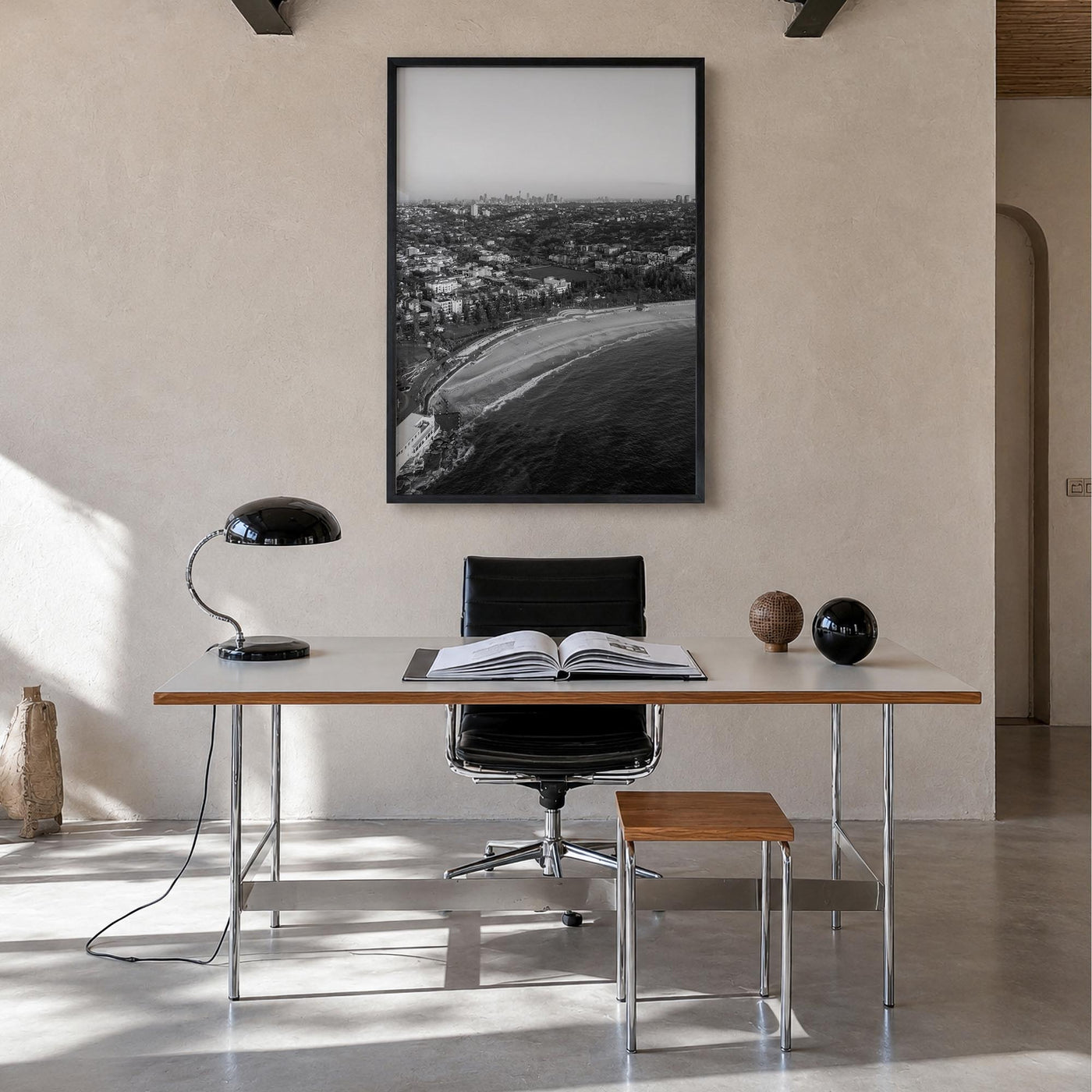 Coogee Beach black & white photo poster of Sydney, New South Wales – vertical wall art in black wood frame, hanging on wall