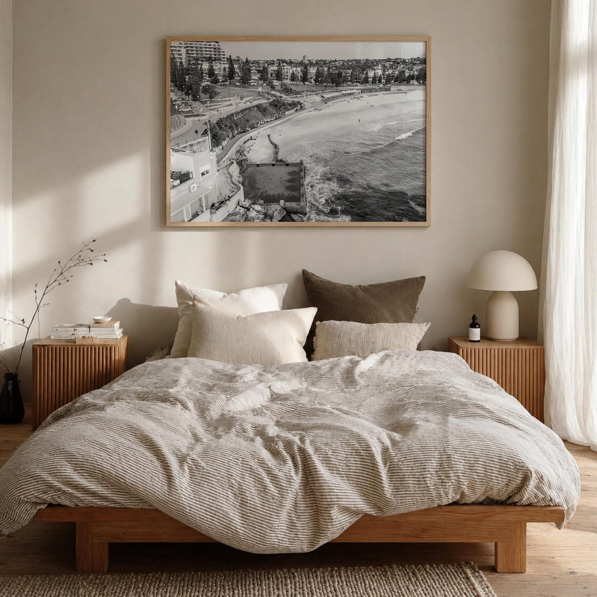 Coogee Beach black & white photo poster of Sydney, New South Wales – horizontal wall art in natural wood frame, hanging on wa