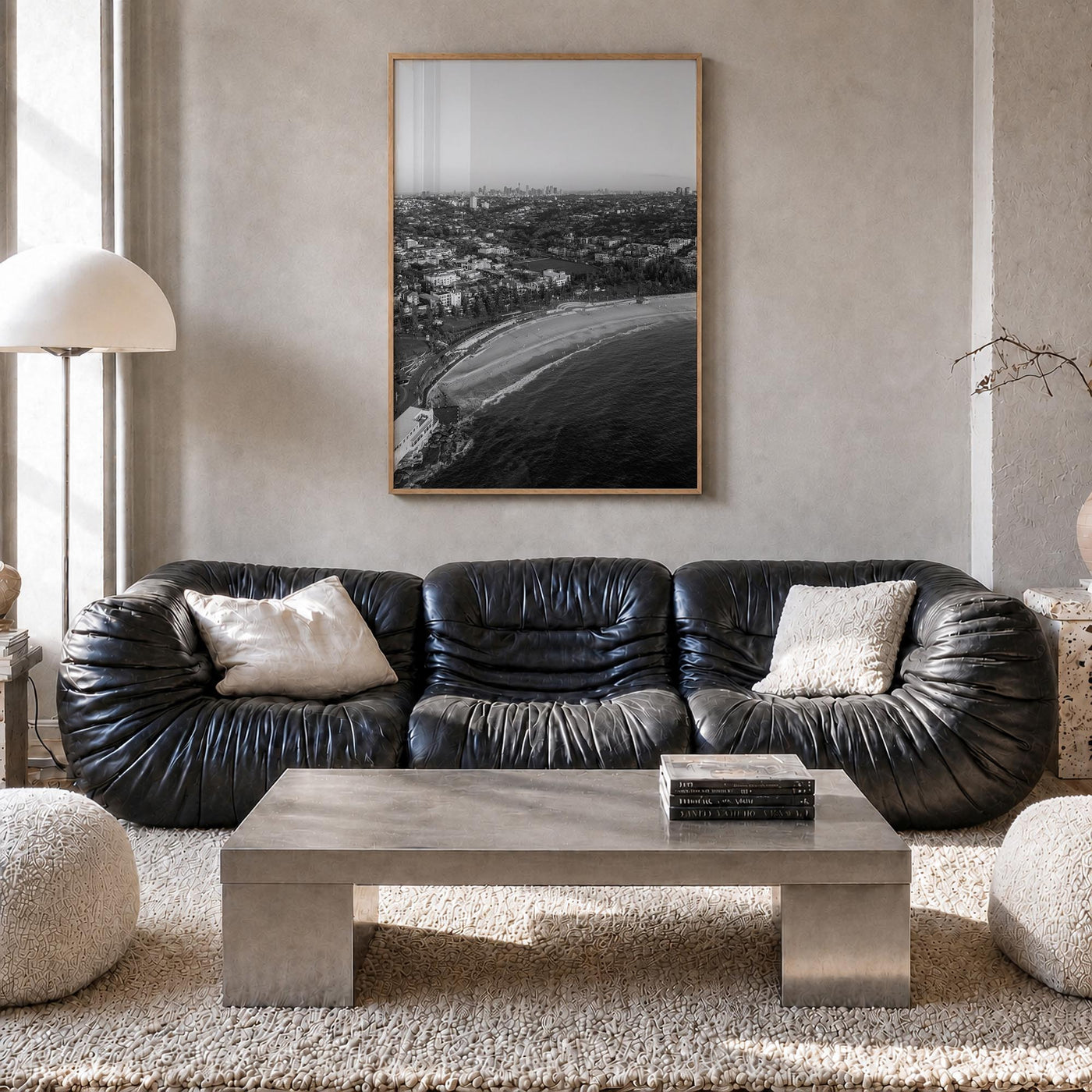 Coogee Beach black & white photo poster of Sydney, New South Wales – vertical wall art in natural wood frame, hanging on wall