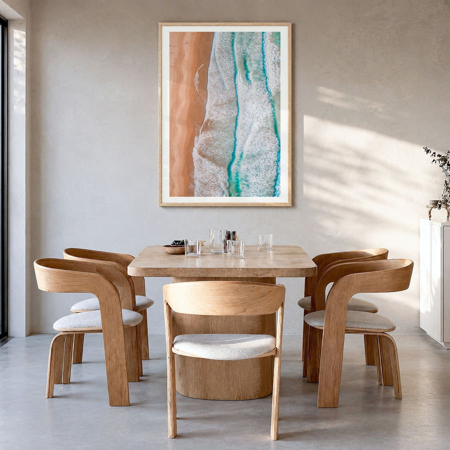 Coogee Beach Photo No 3 Poster in a natural wood frame, hanging in a dining room, white border