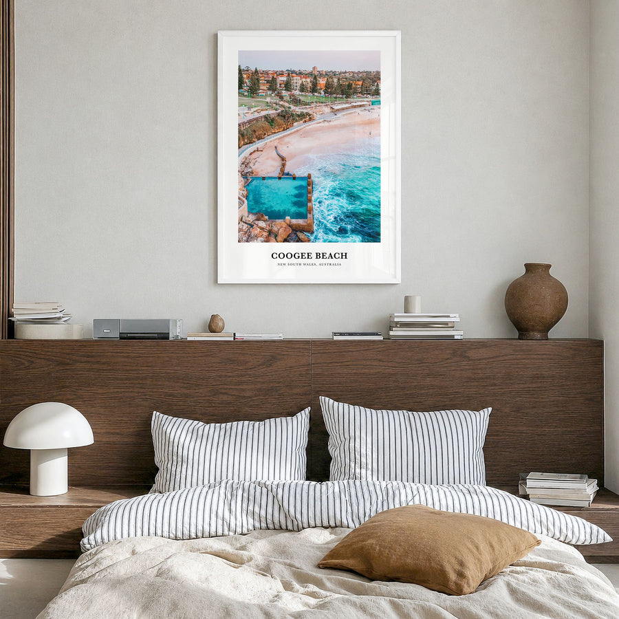 Coogee Beach Classic No 1 Poster in a white wood frame, hanging in a bedroom
