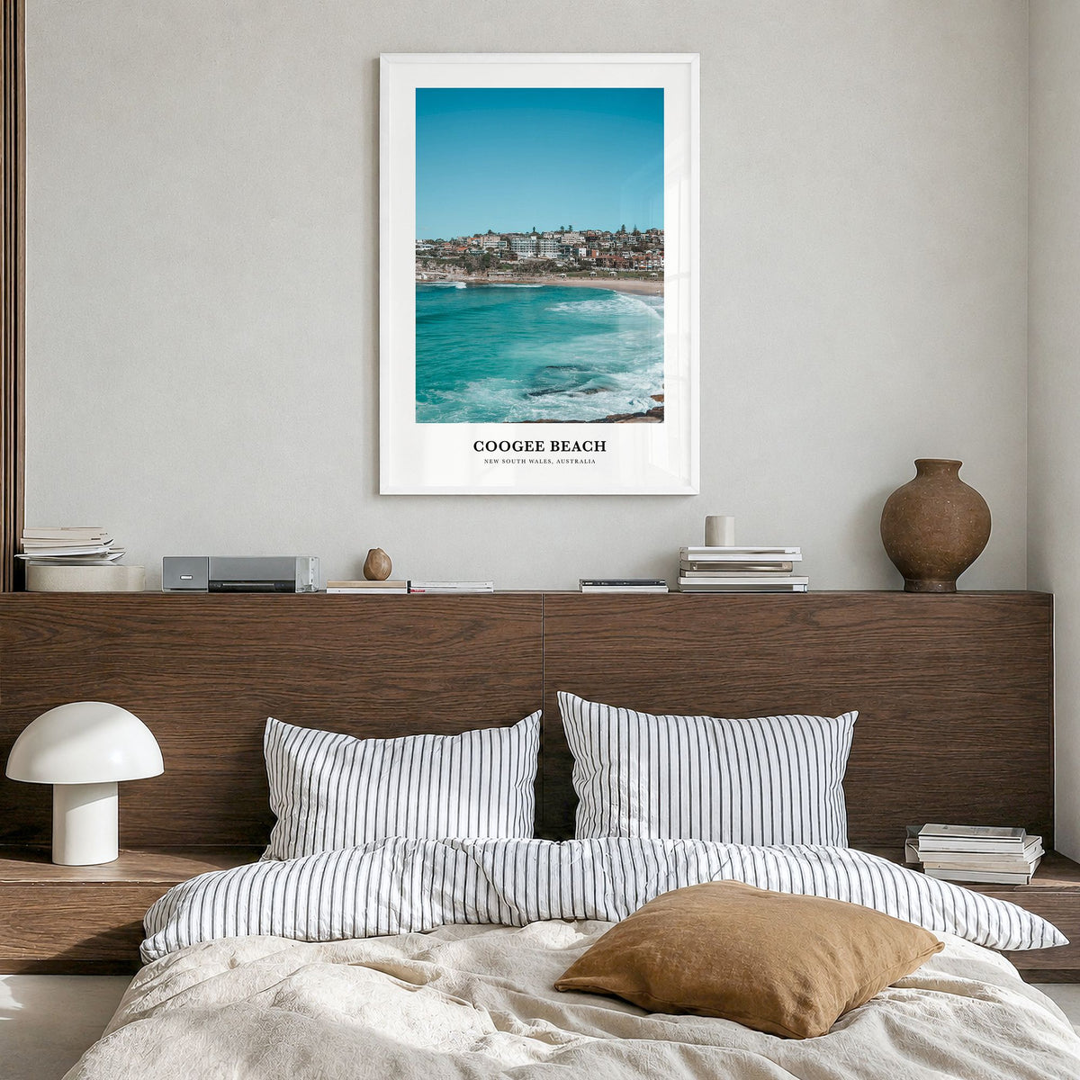 Coogee Beach Classic No 2 Poster in a white wood frame, hanging in a bedroom