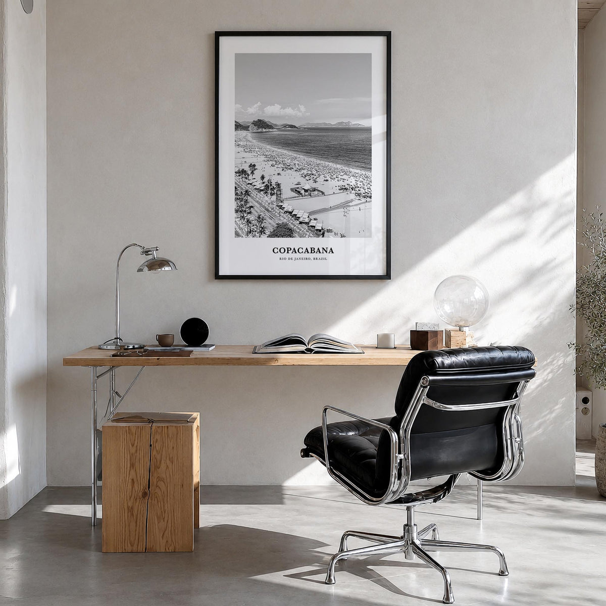 Copacabana black & white classic poster of Rio de Janeiro, Brazil – vertical wall art in black wood frame, hanging on wall