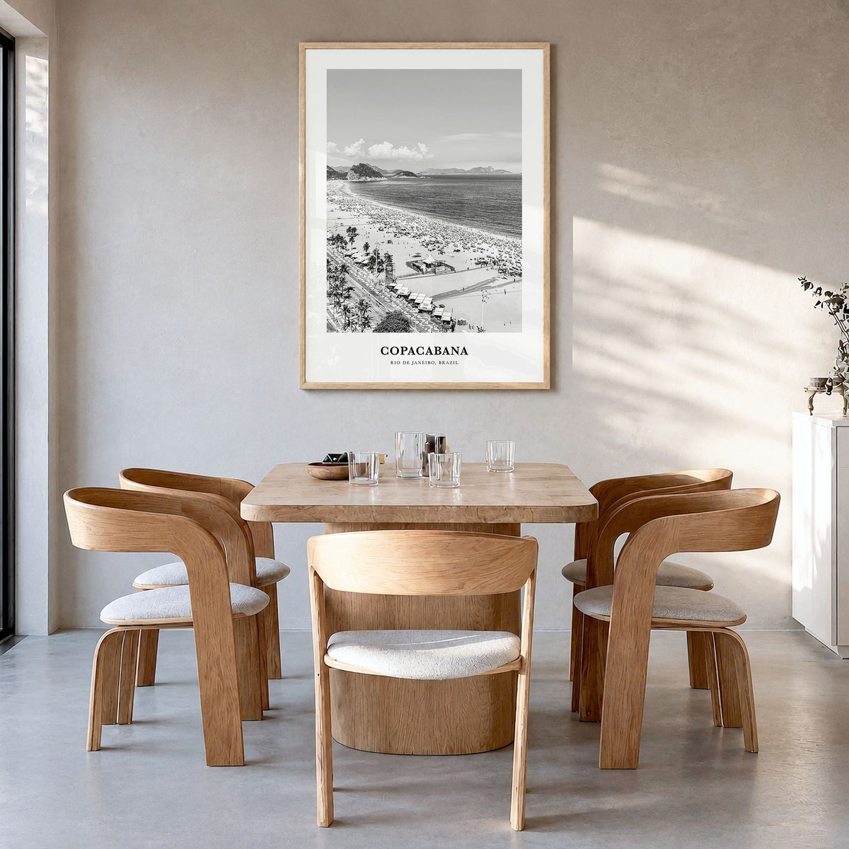 Copacabana Classic Poster in a natural wood frame, hanging in a dining room