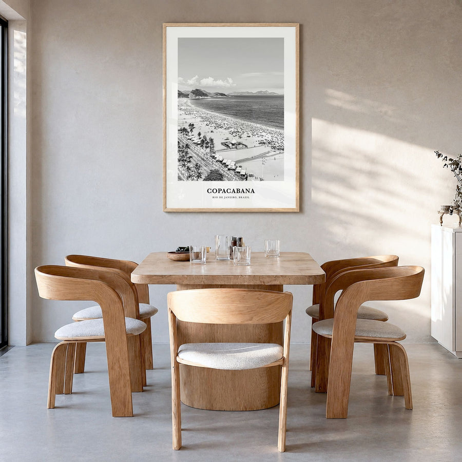 Copacabana Classic Poster in a natural wood frame, hanging in a dining room