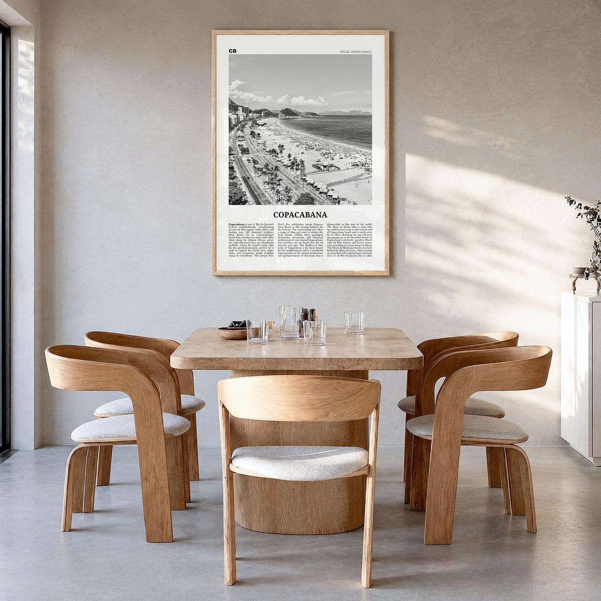 Copacabana Newspaper Poster in a natural wood frame, hanging in a dining room