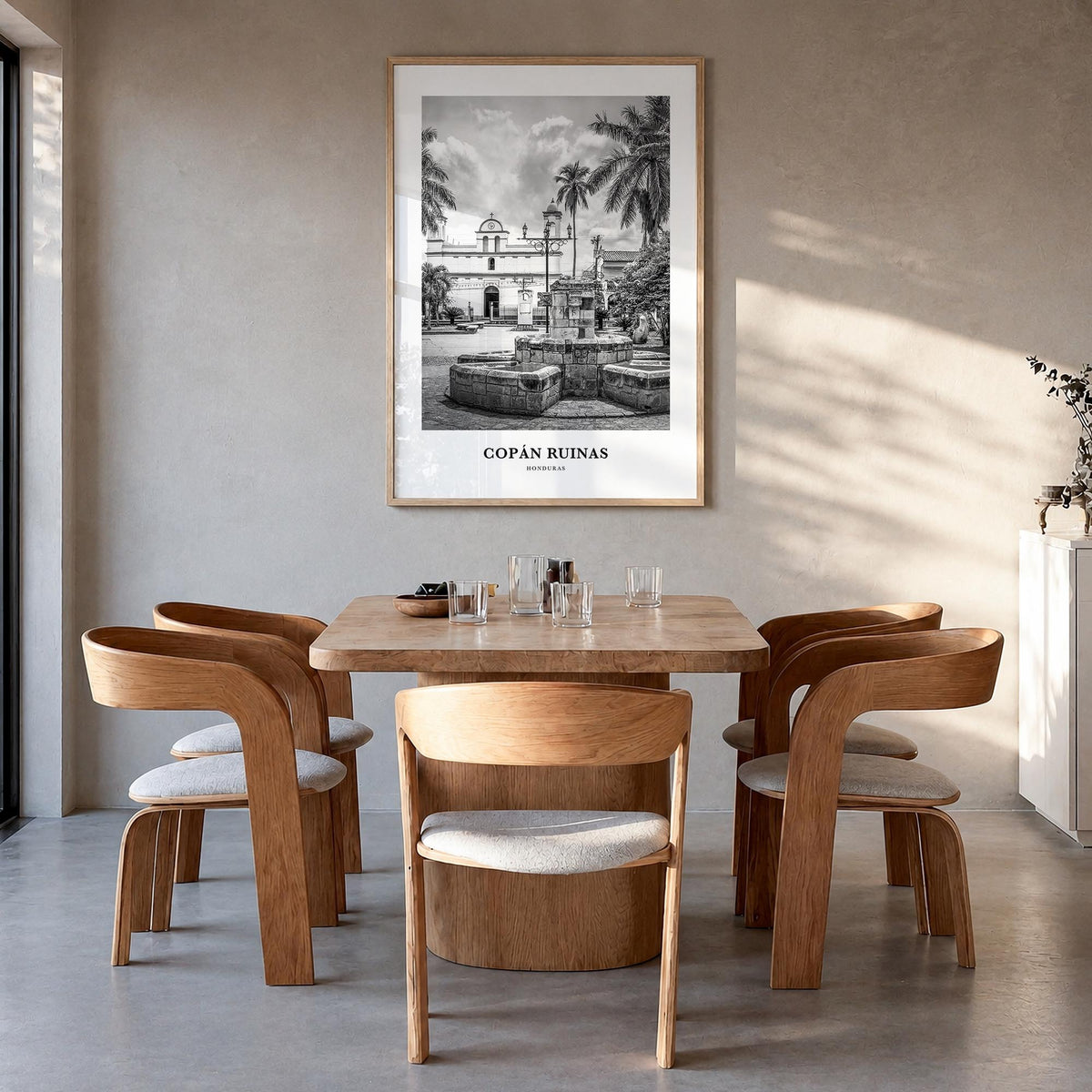 Copán Ruinas black & white classic poster of Honduras – vertical wall art in natural wood frame, hanging on wall