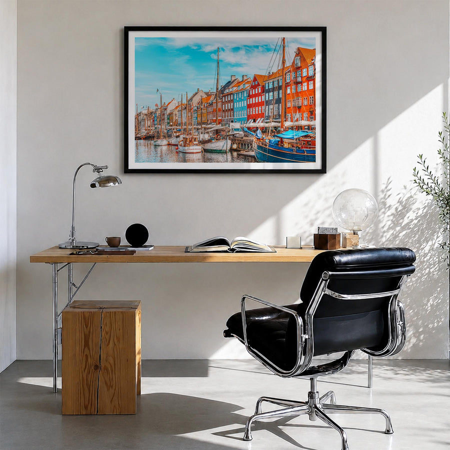 Copenhagen colorful photo poster of Denmark – horizontal wall art in black wood frame with white border, hanging on wall