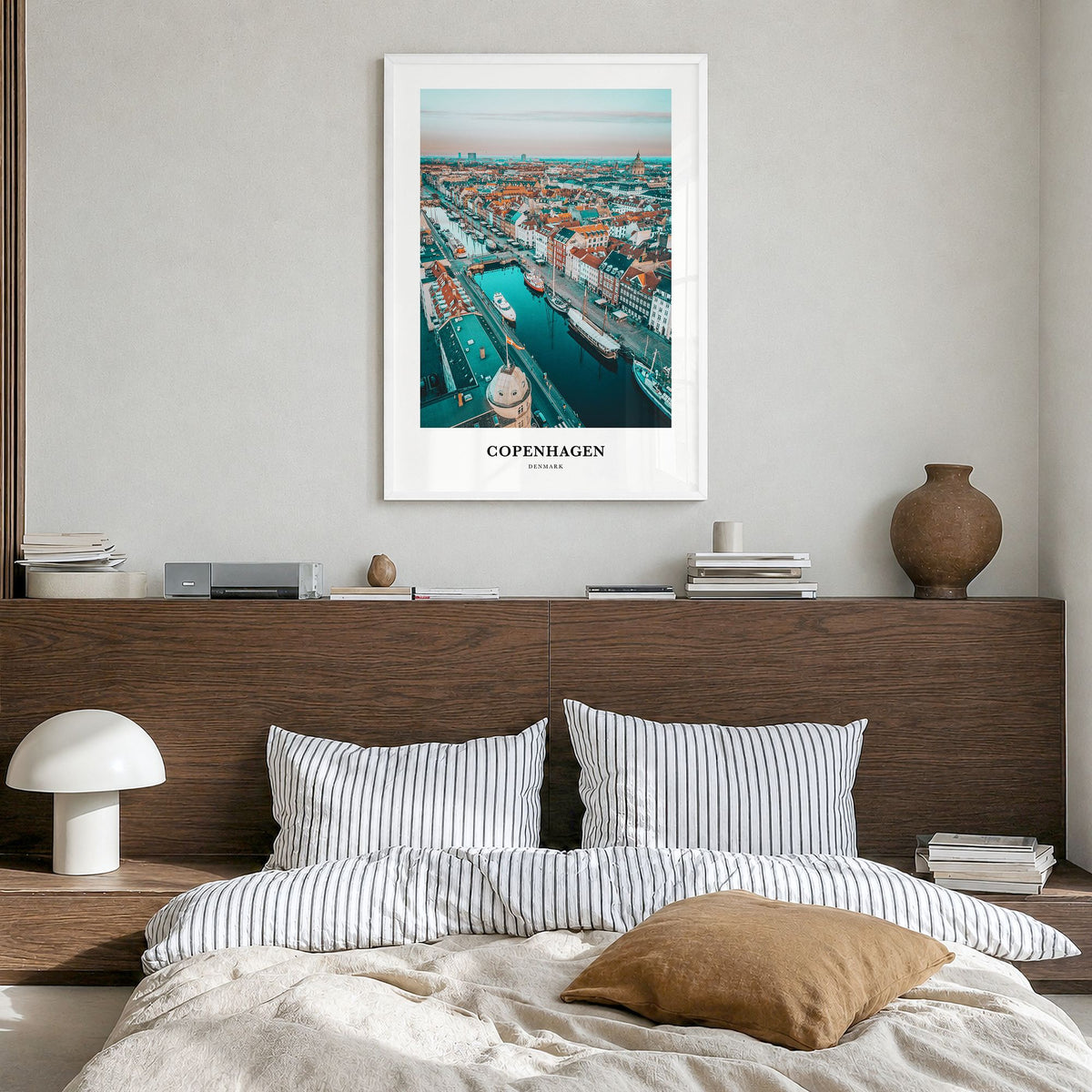 Copenhagen Classic Poster in a white wood frame, hanging in a bedroom