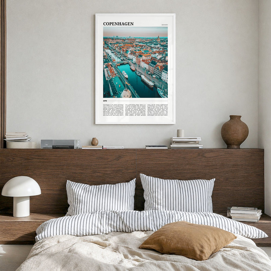 Copenhagen Travel Poster in a white wood frame, hanging in a bedroom