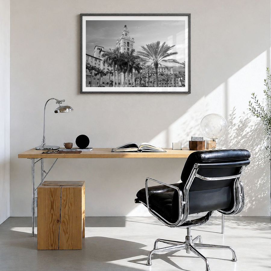 Coral Gables Photo Poster in a black wood frame, hanging in a bright home office, white border