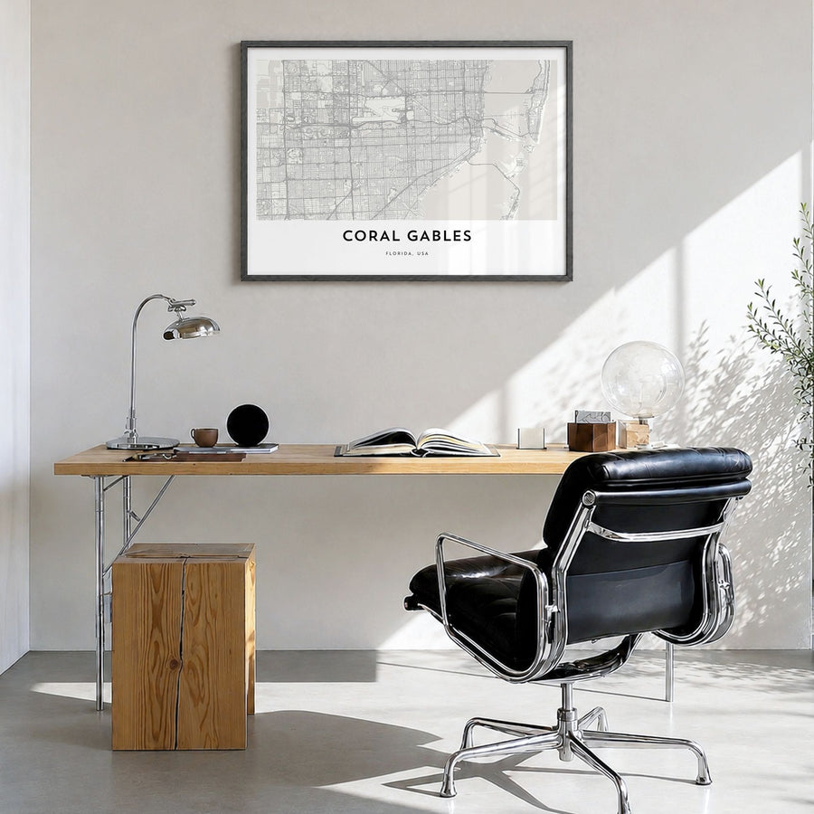 Coral Gables Map Poster in a black wood frame, hanging in a bright home office