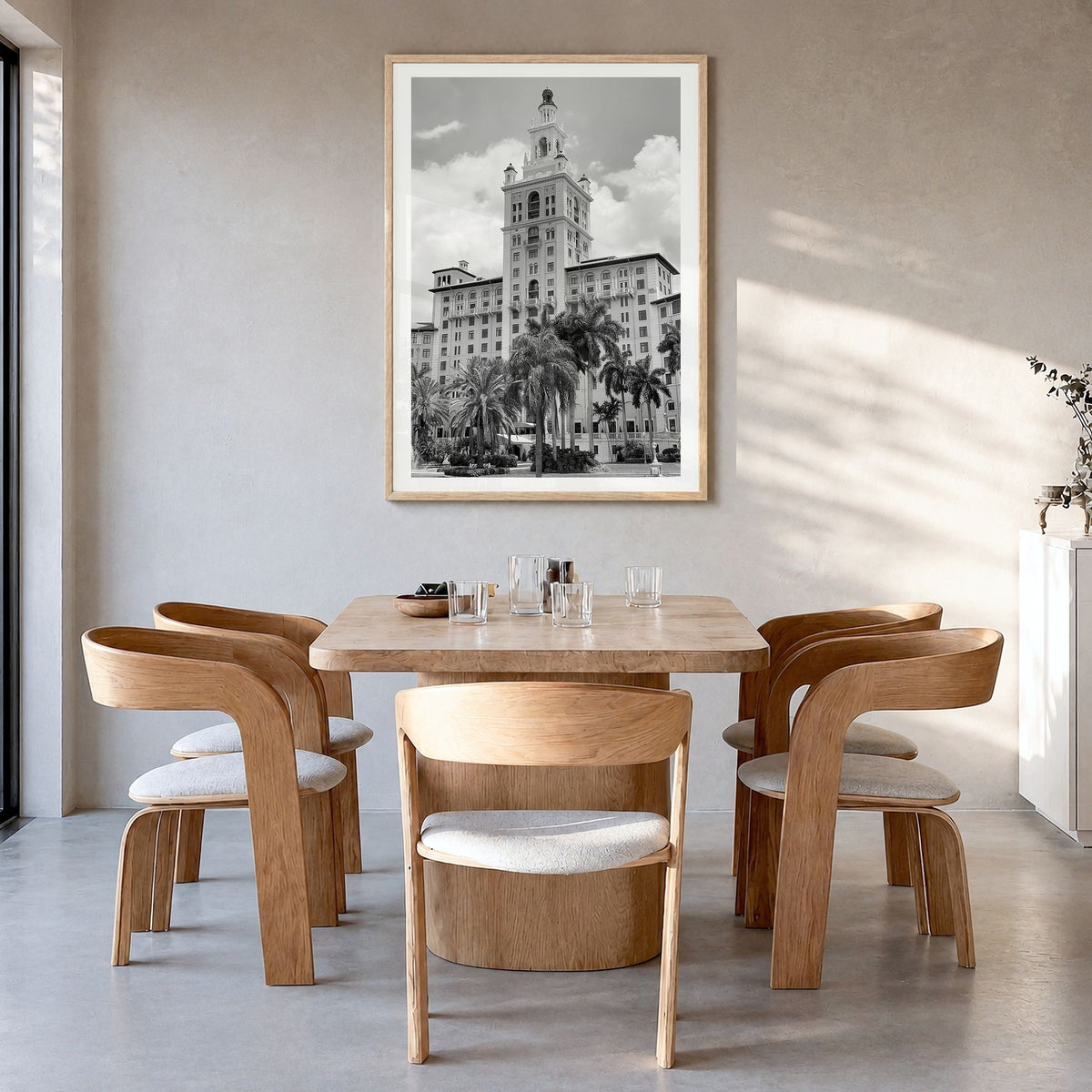 Coral Gables Photo Poster in a natural wood frame, hanging in a dining room, white border
