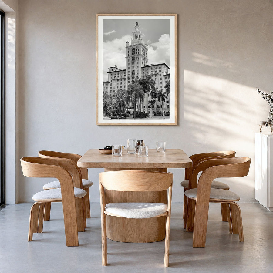 Coral Gables Photo Poster in a natural wood frame, hanging in a dining room, white border