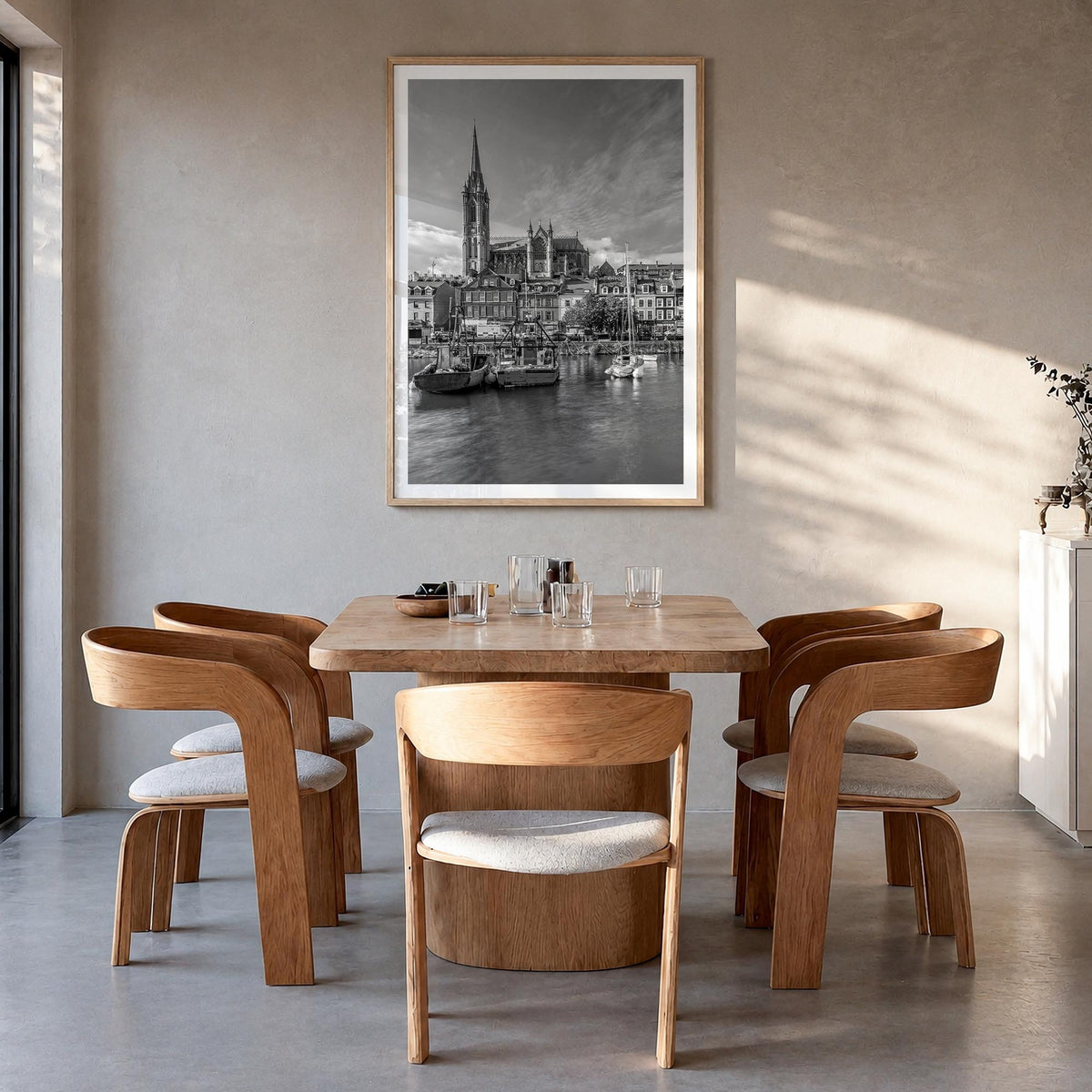 Cork black & white photo poster of Ireland – vertical wall art in natural wood frame with white border, hanging on wall