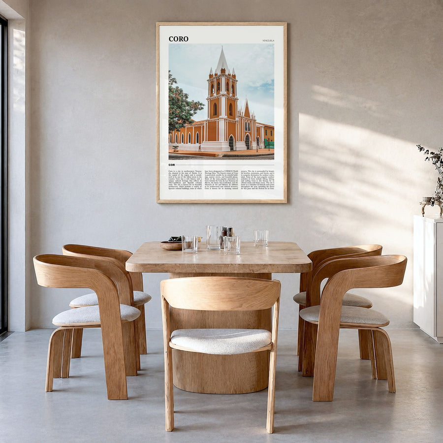 Coro Travel Poster in a natural wood frame, hanging in a dining room