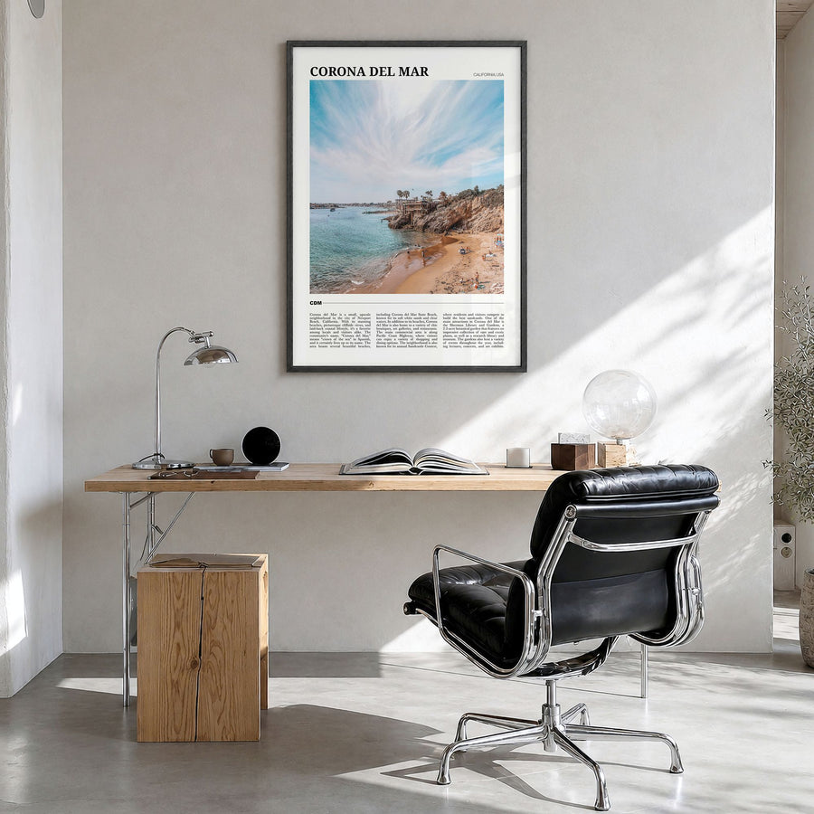 Corona del Mar Travel Poster in a black wood frame, hanging in a bright home office