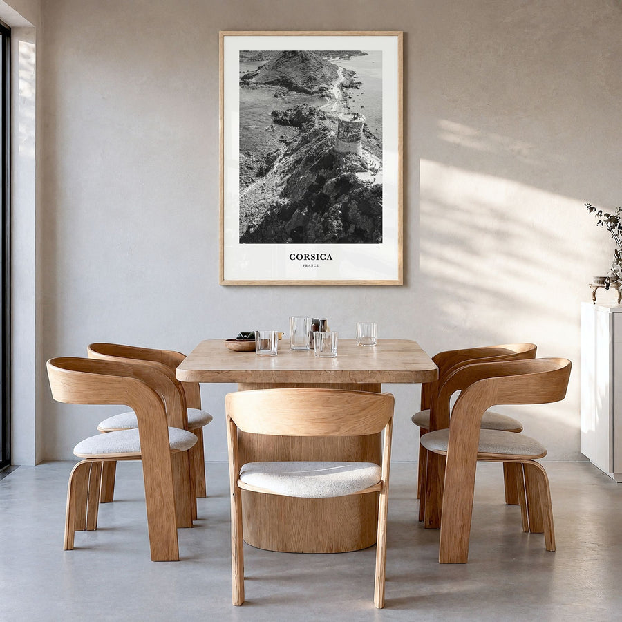 Corsica Classic Poster in a natural wood frame, hanging in a dining room