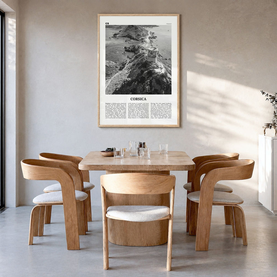 Corsica Newspaper Poster in a natural wood frame, hanging in a dining room