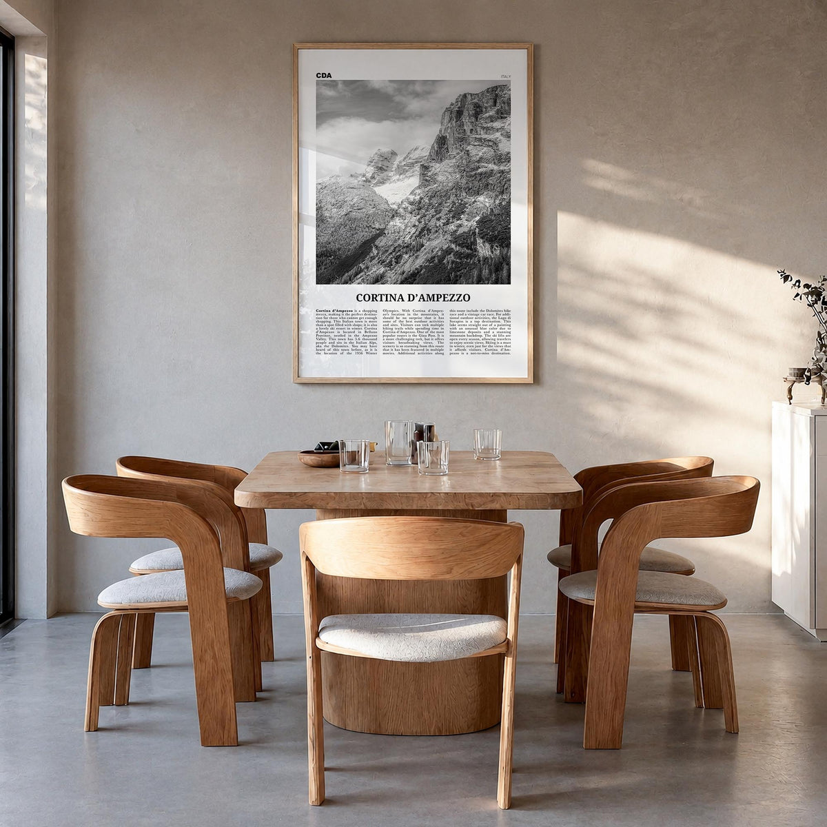Cortina d'Ampezzo black & white newspaper poster of Italy – vertical wall art in natural wood frame, hanging on wall