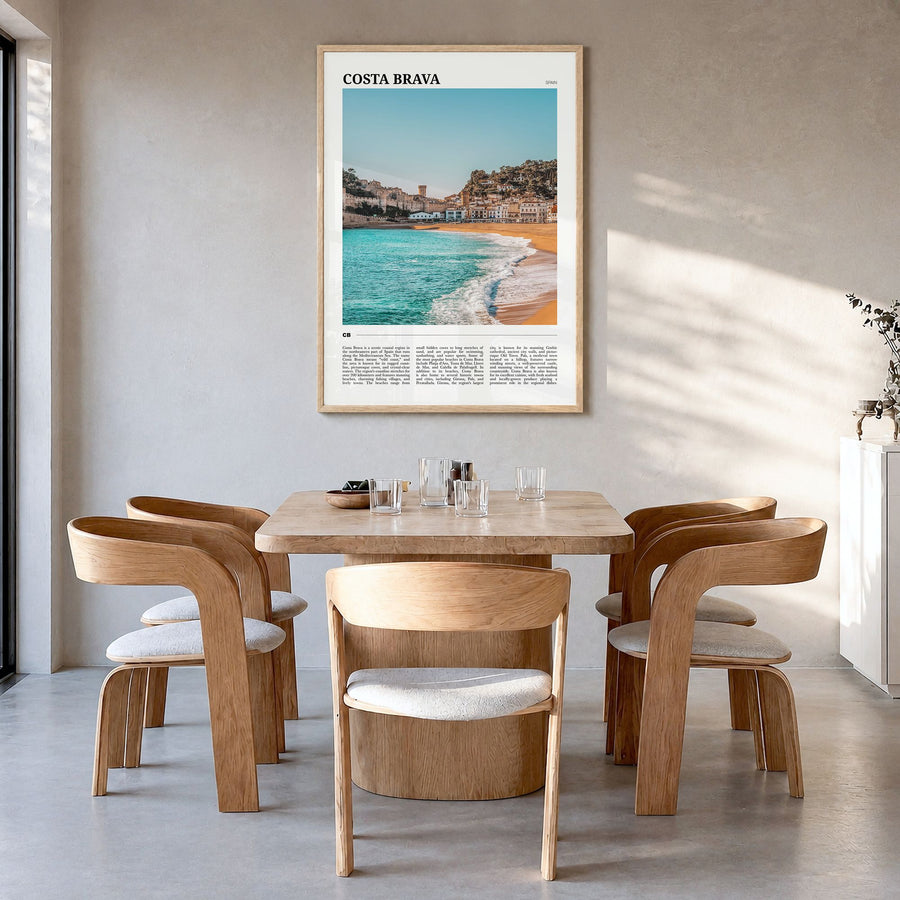 Costa Brava Travel No 1 Poster in a natural wood frame, hanging in a dining room