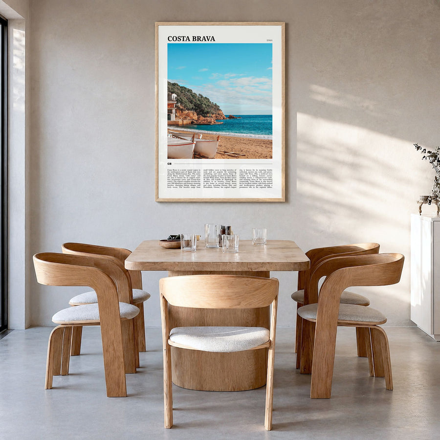 Costa Brava Travel No 2 Poster in a natural wood frame, hanging in a dining room