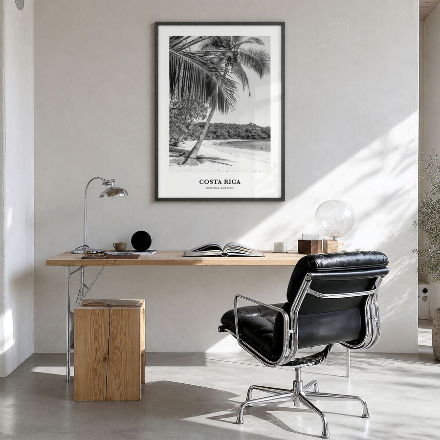 Costa Rica Classic No 1 Poster in a black wood frame, hanging in a bright home office