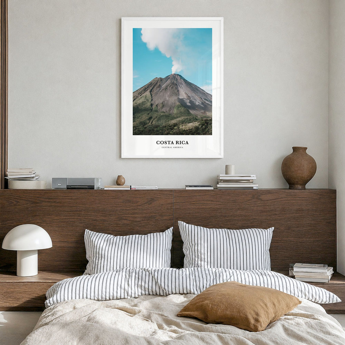 Costa Rica Classic Poster in a white wood frame, hanging in a bedroom