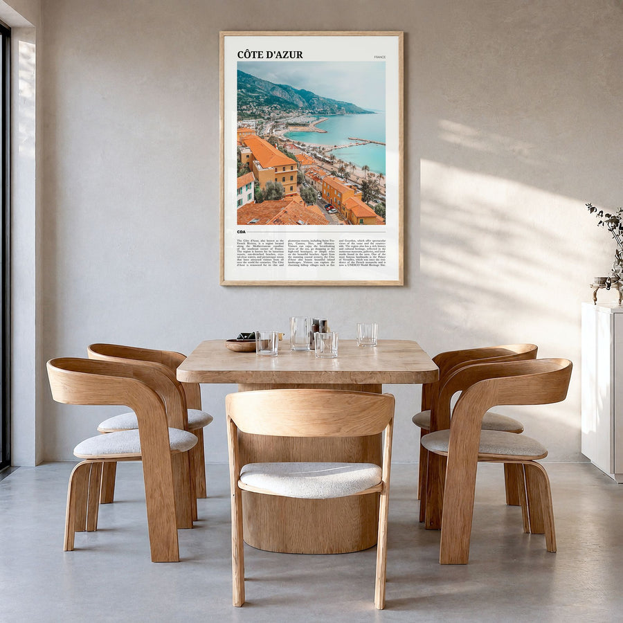 Côte d'Azur Travel No 1 Poster in a natural wood frame, hanging in a dining room
