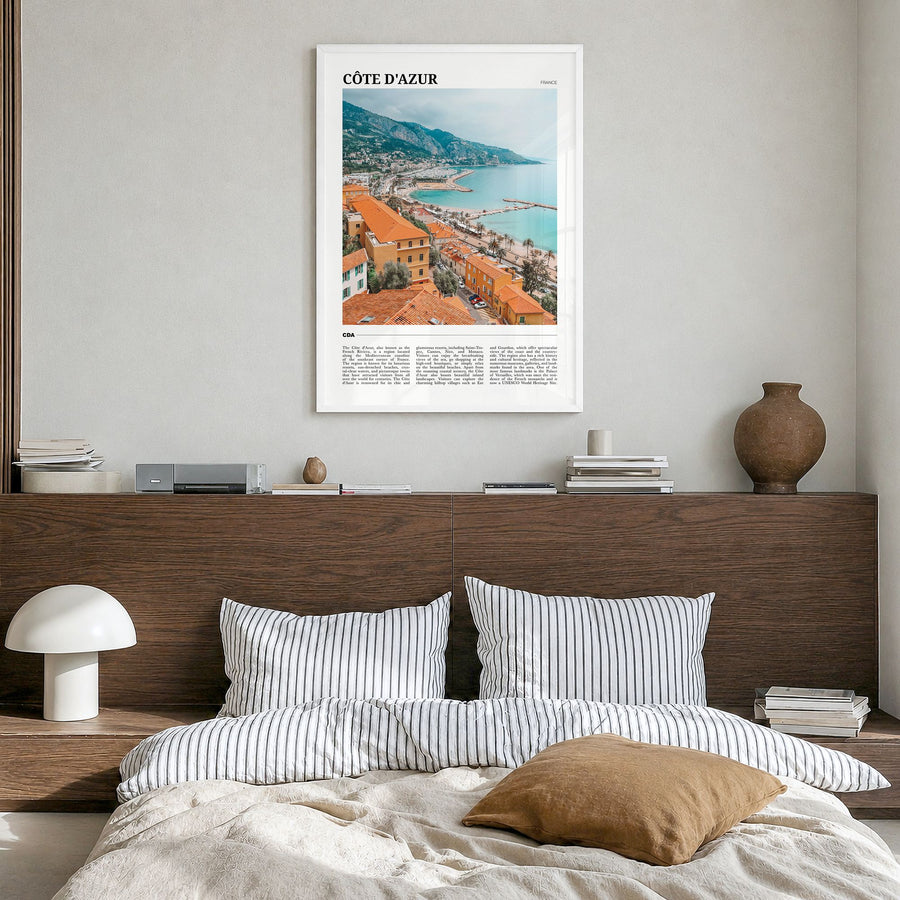 Côte d'Azur Travel No 1 Poster in a white wood frame, hanging in a bedroom