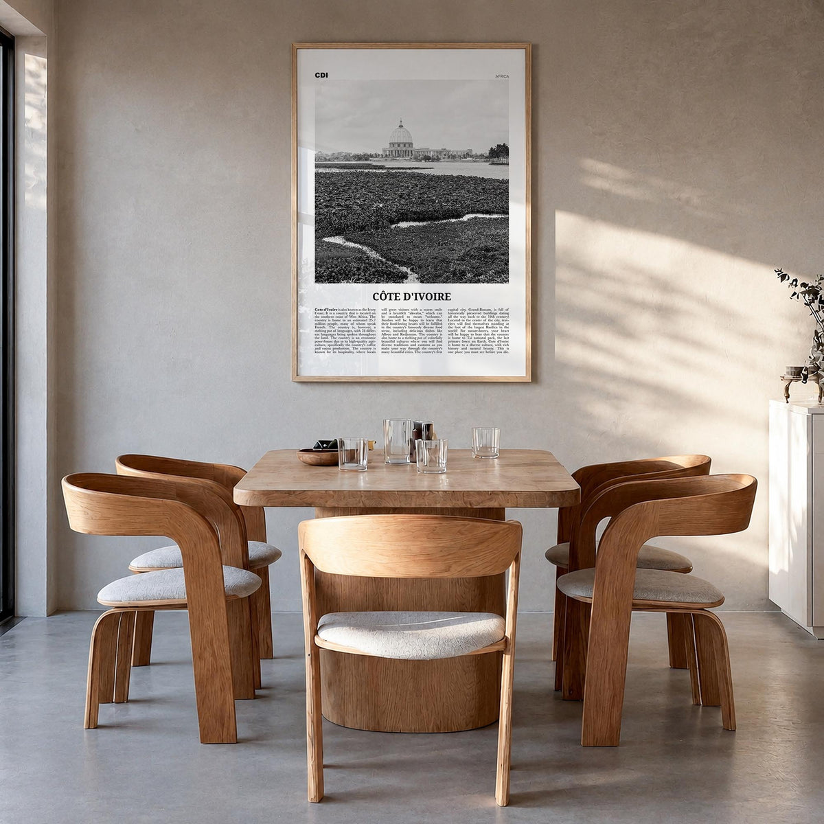 Côte d'Ivoire black & white newspaper poster of Africa – vertical wall art in natural wood frame, hanging on wall