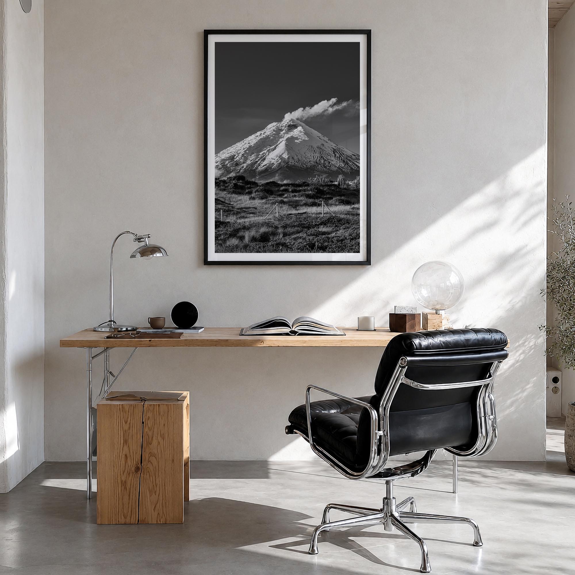 Cotopaxi black & white photo poster of Ecuador – vertical wall art in black wood frame with white border, hanging on wall