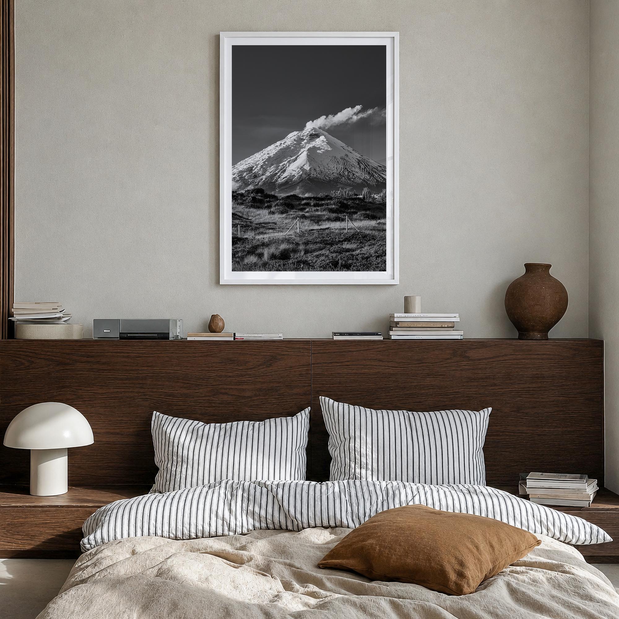 Cotopaxi black & white photo poster of Ecuador – vertical wall art in white wood frame with white border, hanging on wall