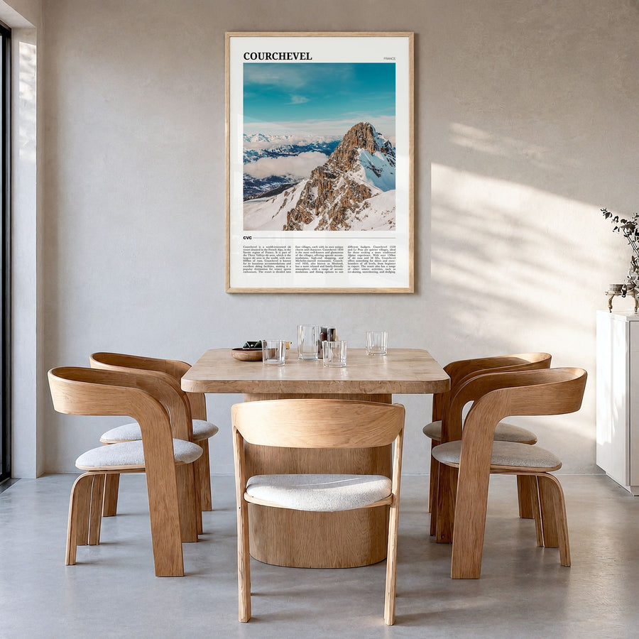 Courchevel Travel Poster in a natural wood frame, hanging in a dining room