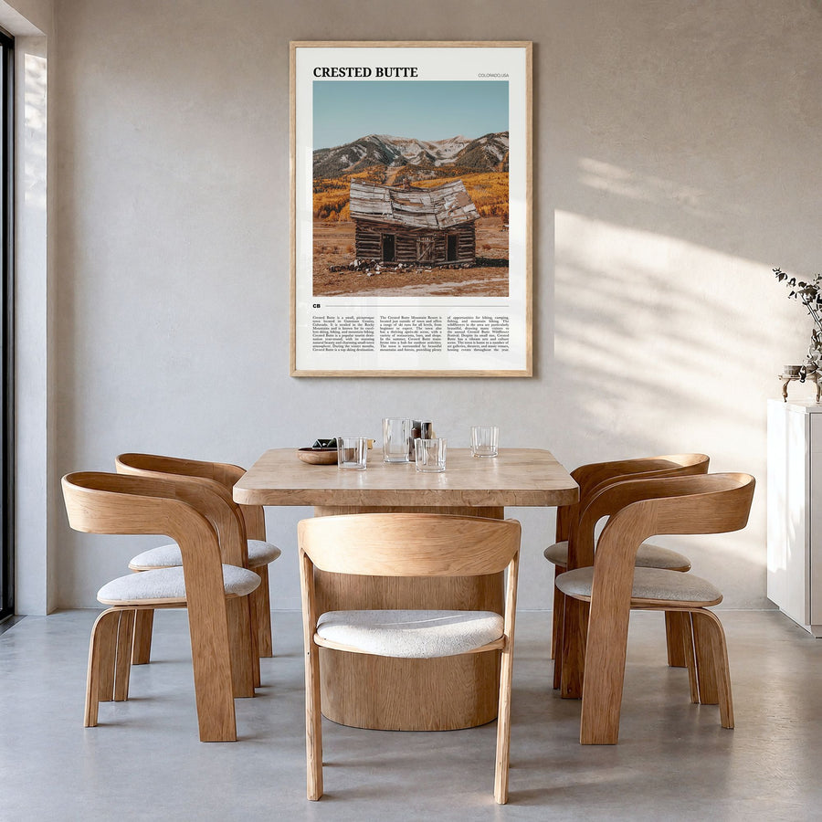 Crested Butte Travel Poster in a natural wood frame, hanging in a dining room