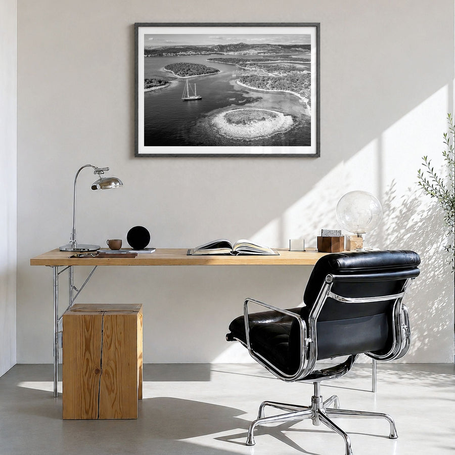 Croatia Photo Poster in a black wood frame, hanging in a bright home office, white border
