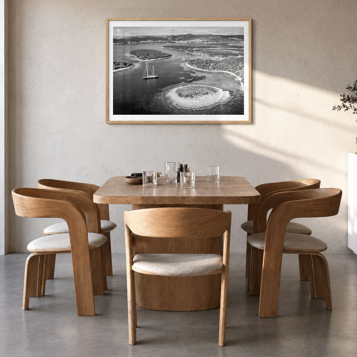 Croatia Photo Poster in a natural wood frame, hanging in a dining room, white border