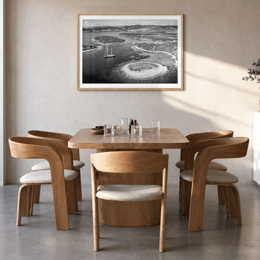 Croatia Photo Poster in a natural wood frame, hanging in a dining room, white border