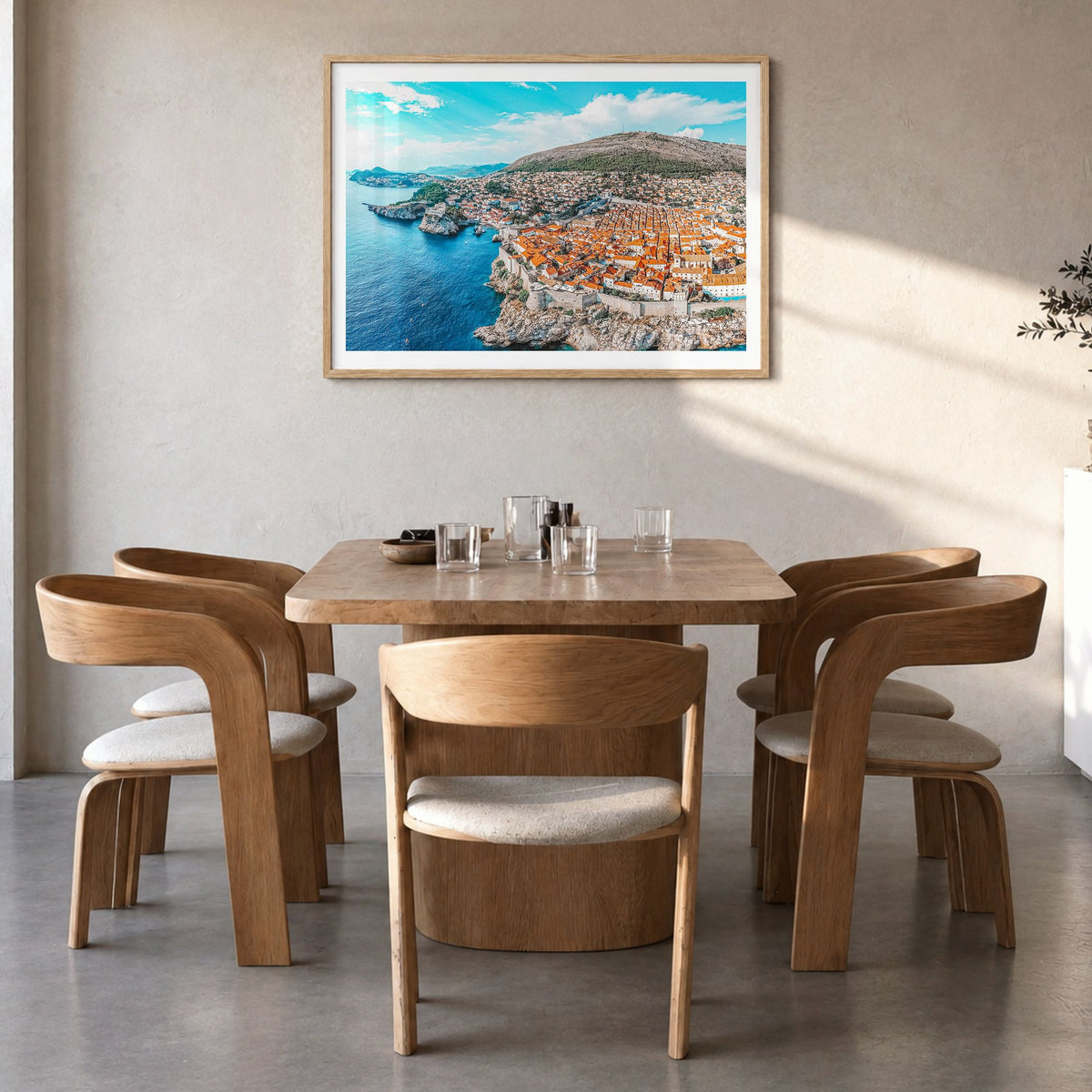 Croatia Photo Poster in a natural wood frame, hanging in a dining room, white border