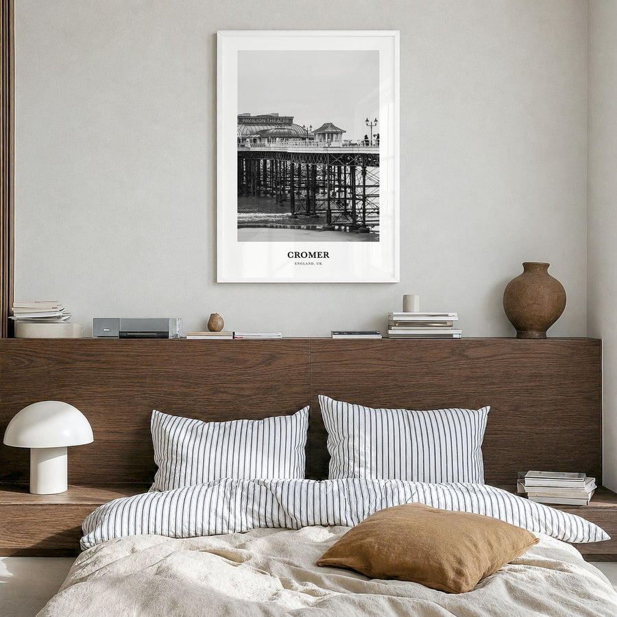 Cromer Classic Poster in a white wood frame, hanging in a bedroom