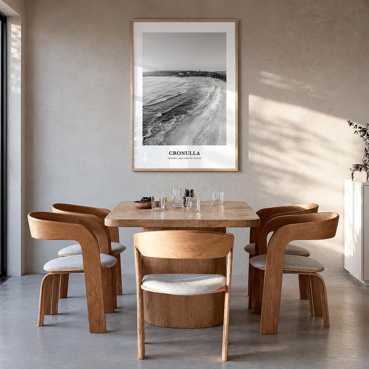 Cronulla black & white classic poster of Australia – vertical wall art in natural wood frame, hanging on wall