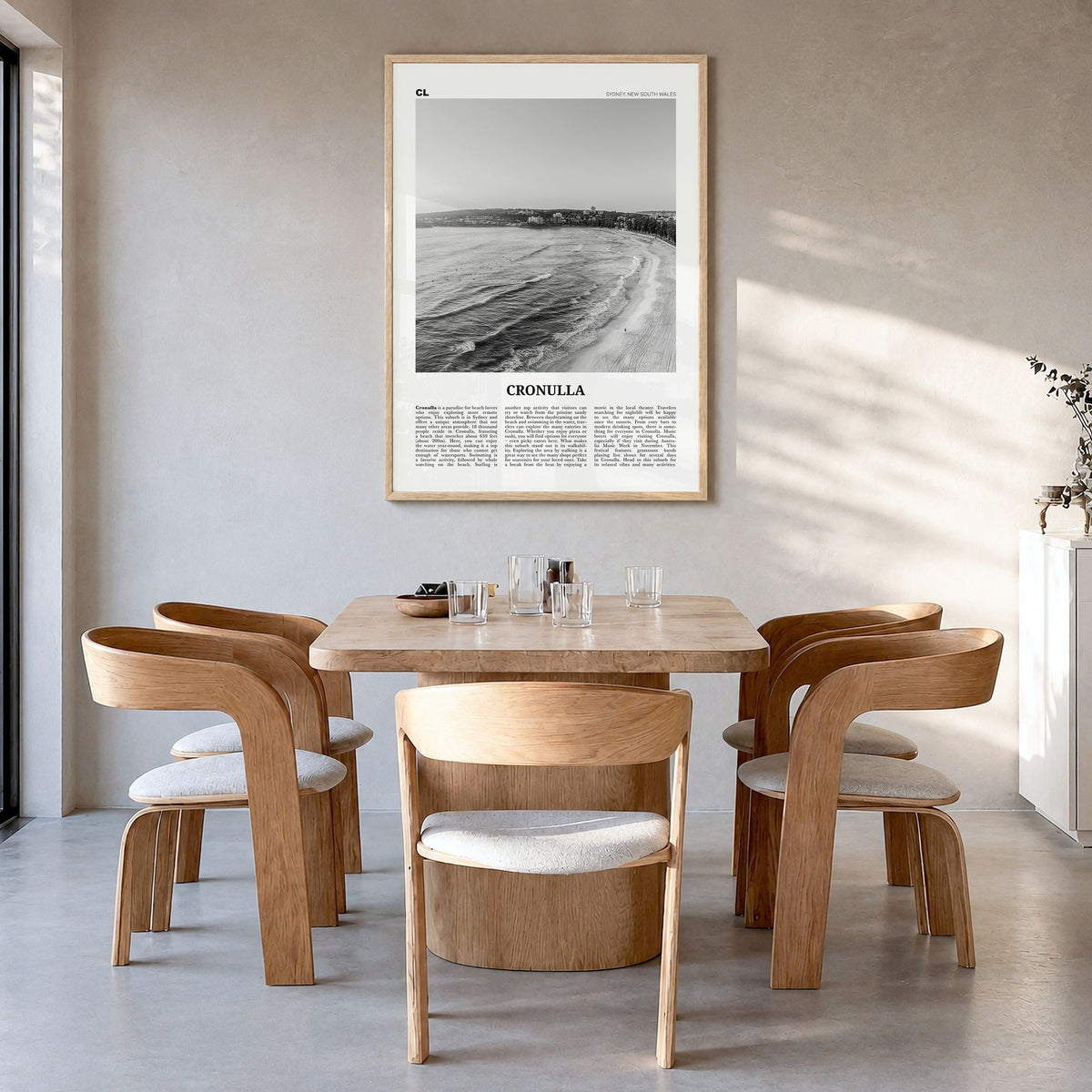 Cronulla Newspaper Poster in a natural wood frame, hanging in a dining room