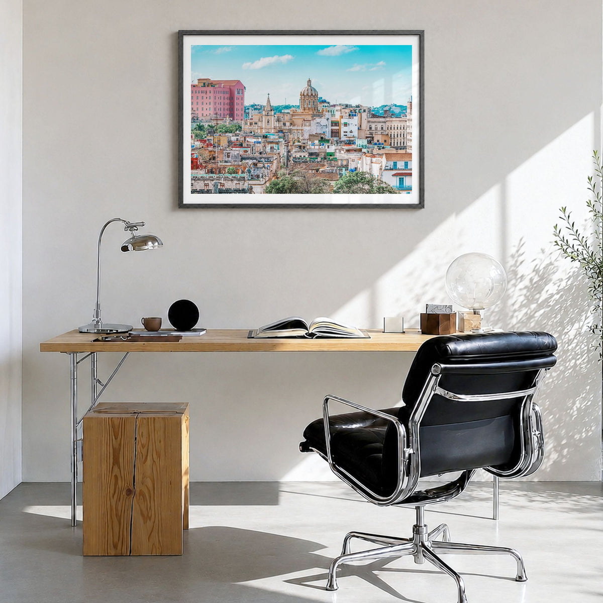 Cuba Photo Poster in a black wood frame, hanging in a bright home office, white border