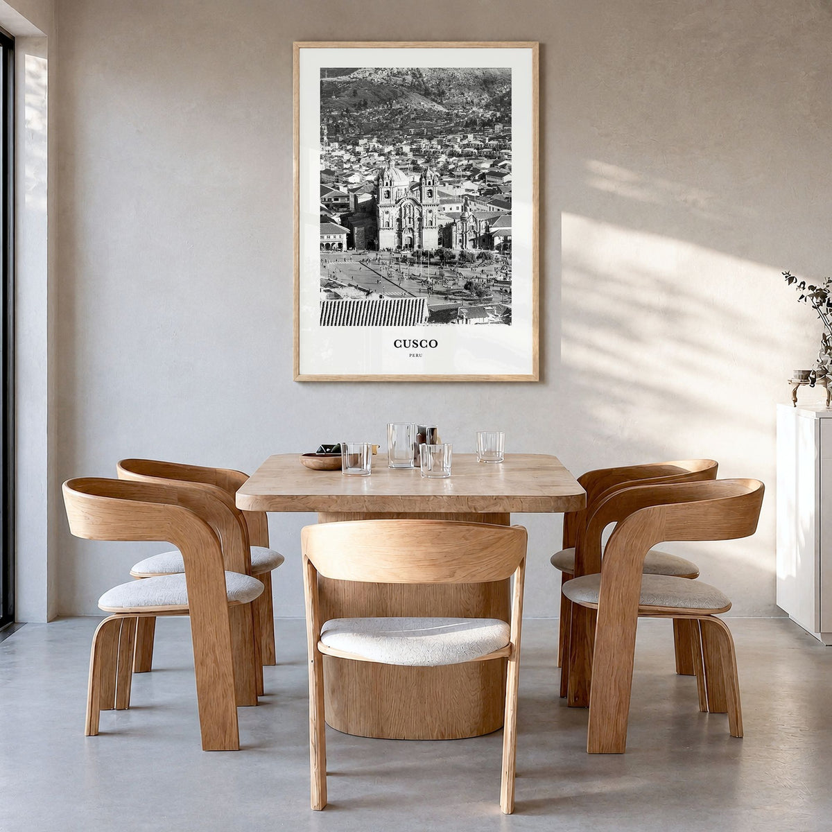 Cusco Classic Poster in a natural wood frame, hanging in a dining room