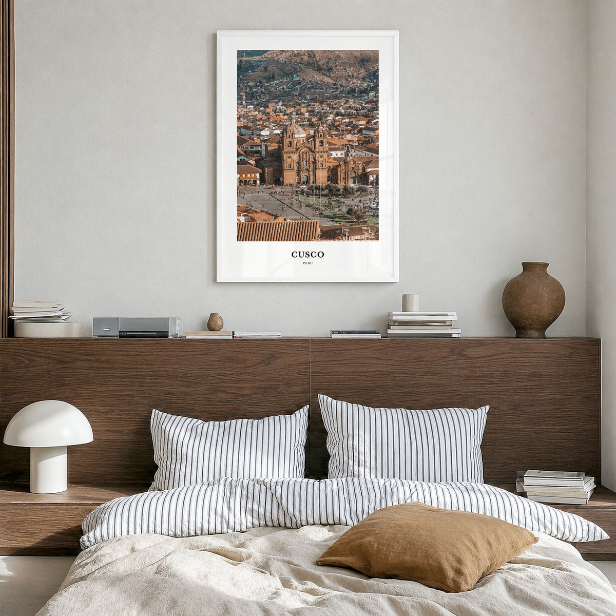 Cusco Classic Poster in a white wood frame, hanging in a bedroom