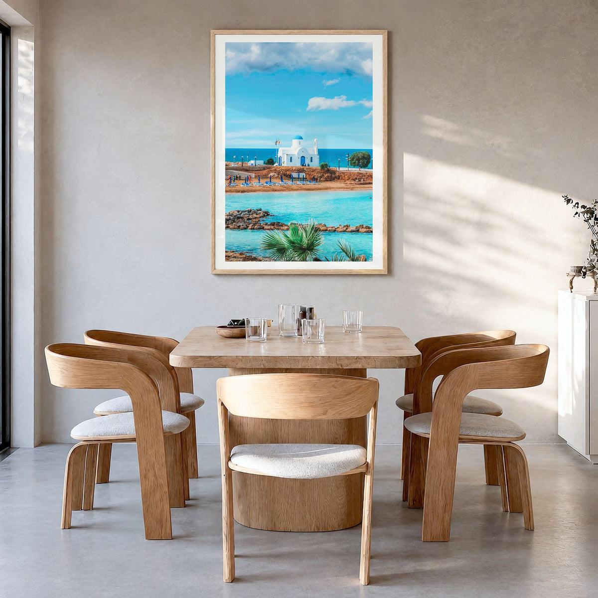 Cyprus Photo Poster in a natural wood frame, hanging in a dining room, white border