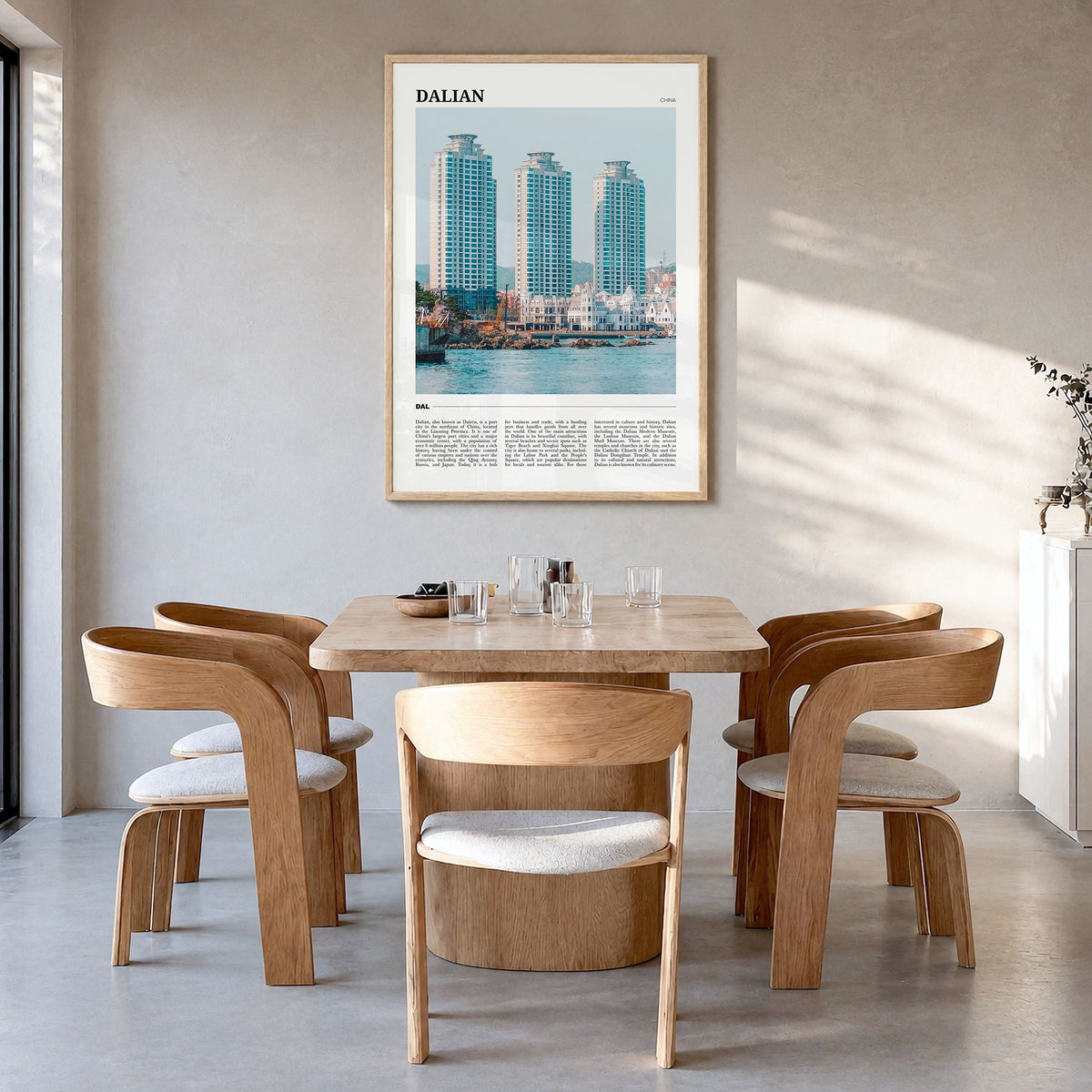 Dalian Travel Poster in a natural wood frame, hanging in a dining room